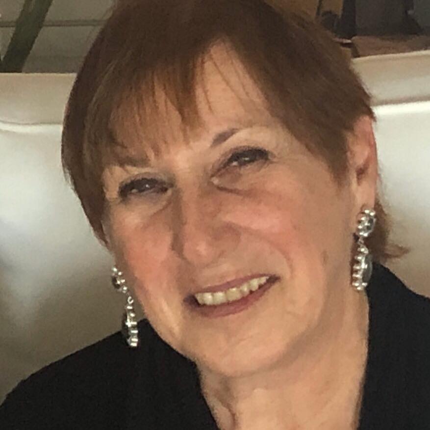 Client testimonial image featuring Roberta Chadis a smiling woman in soft lighting.