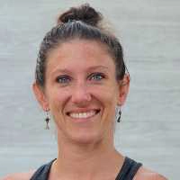 Kim Woods' client, Emily Melden, outdoors smiling at the camera