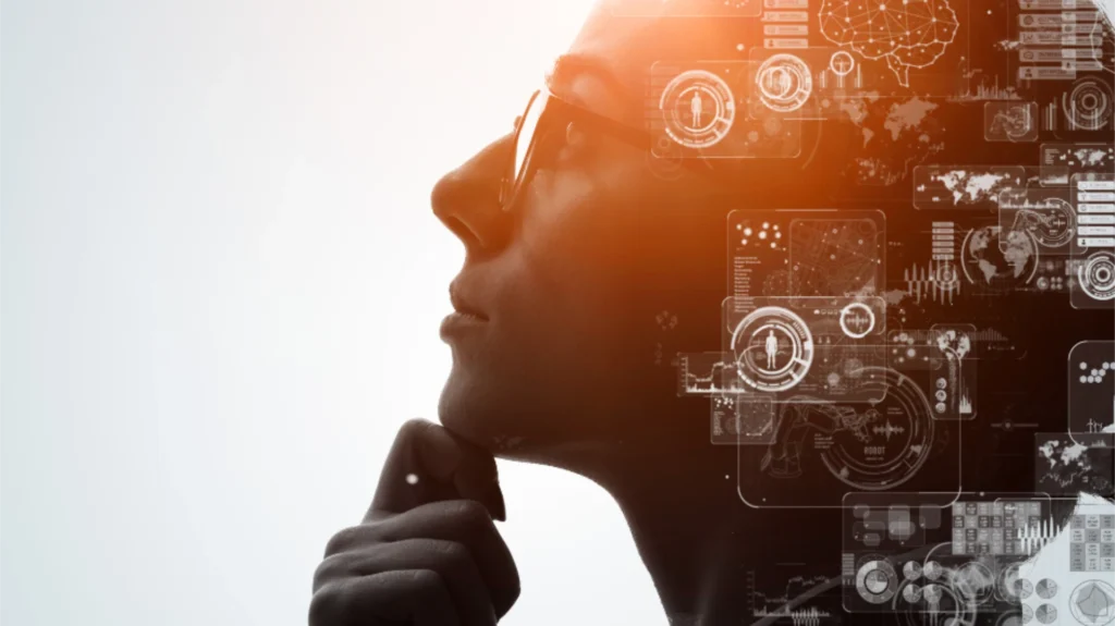 Profile of a person in glasses deep in thought, with digital technology graphics and data charts overlaying their head, symbolizing the fusion of human intuition and artificial intelligence.