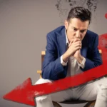 Worried man with question marks overhead sits under a large red downward arrow, symbolizing August challenges. Text reads "August Report" with Kim Woods’ logo in the corner.