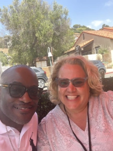 Kim Woods sharing a joyful moment outdoors with a fellow council member, reflecting collaboration and community in the Legacy Council.