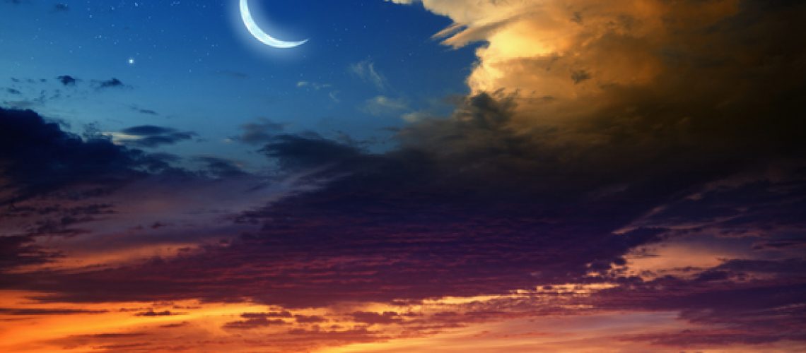 Beautiful background - new moon in dark blue sky with stars, glowing sunset clouds. Elements of this image furnished by NASA nasa.gov
