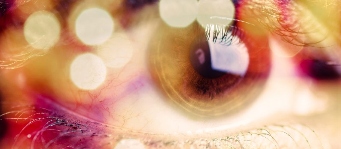 Double exposure of an eye with bokeh. Surreal image of an eye.